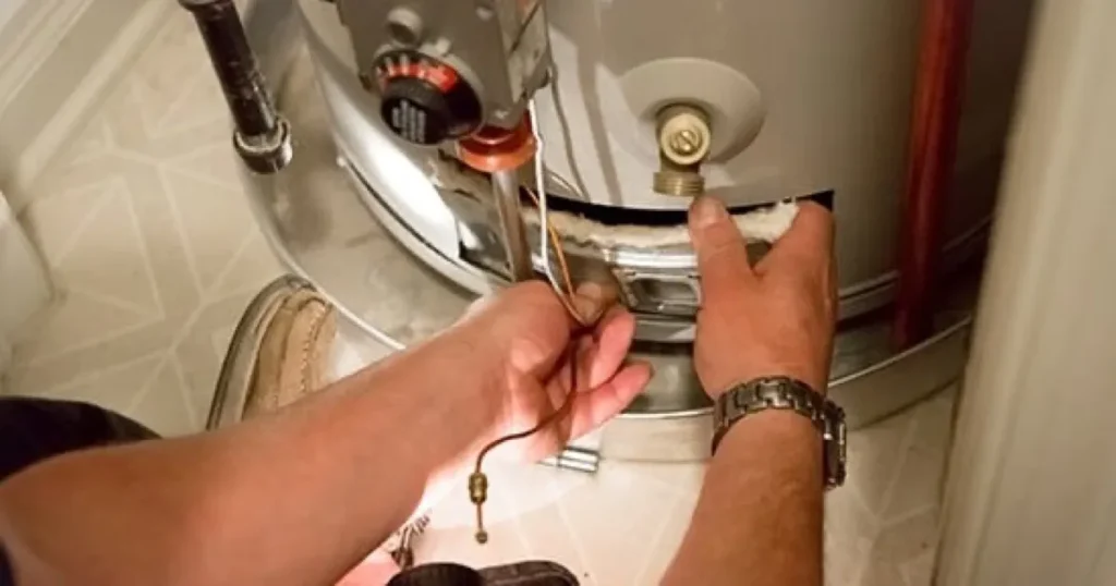 Technician installing a water heater in Portland home.