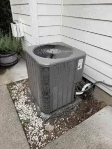 Technician diagnosing a newer AC blowing warm air at a Clackamas home.